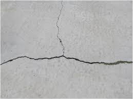 Should I be concerned about small cracks in my stucco?